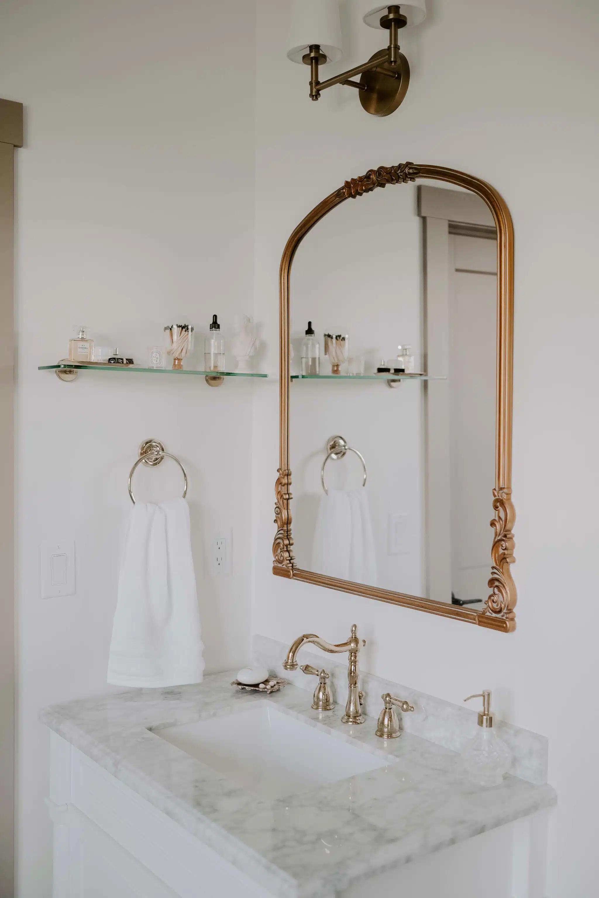 white marble vanity in primary bathroom
