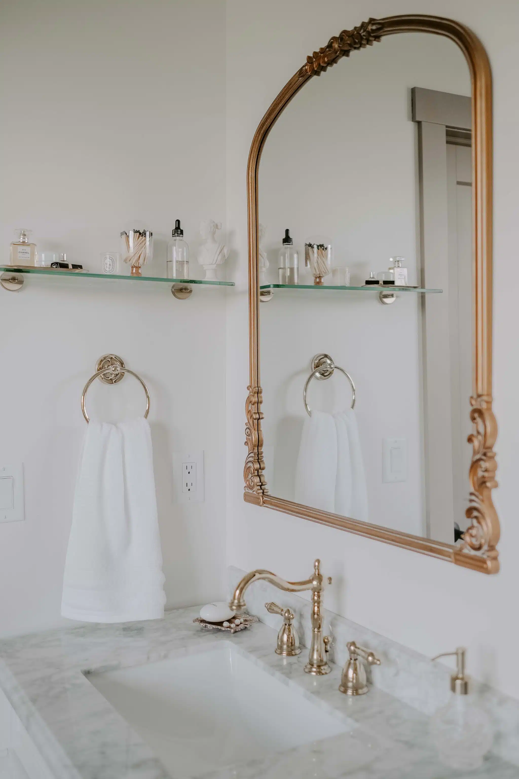 brass, marble, and white bathroom