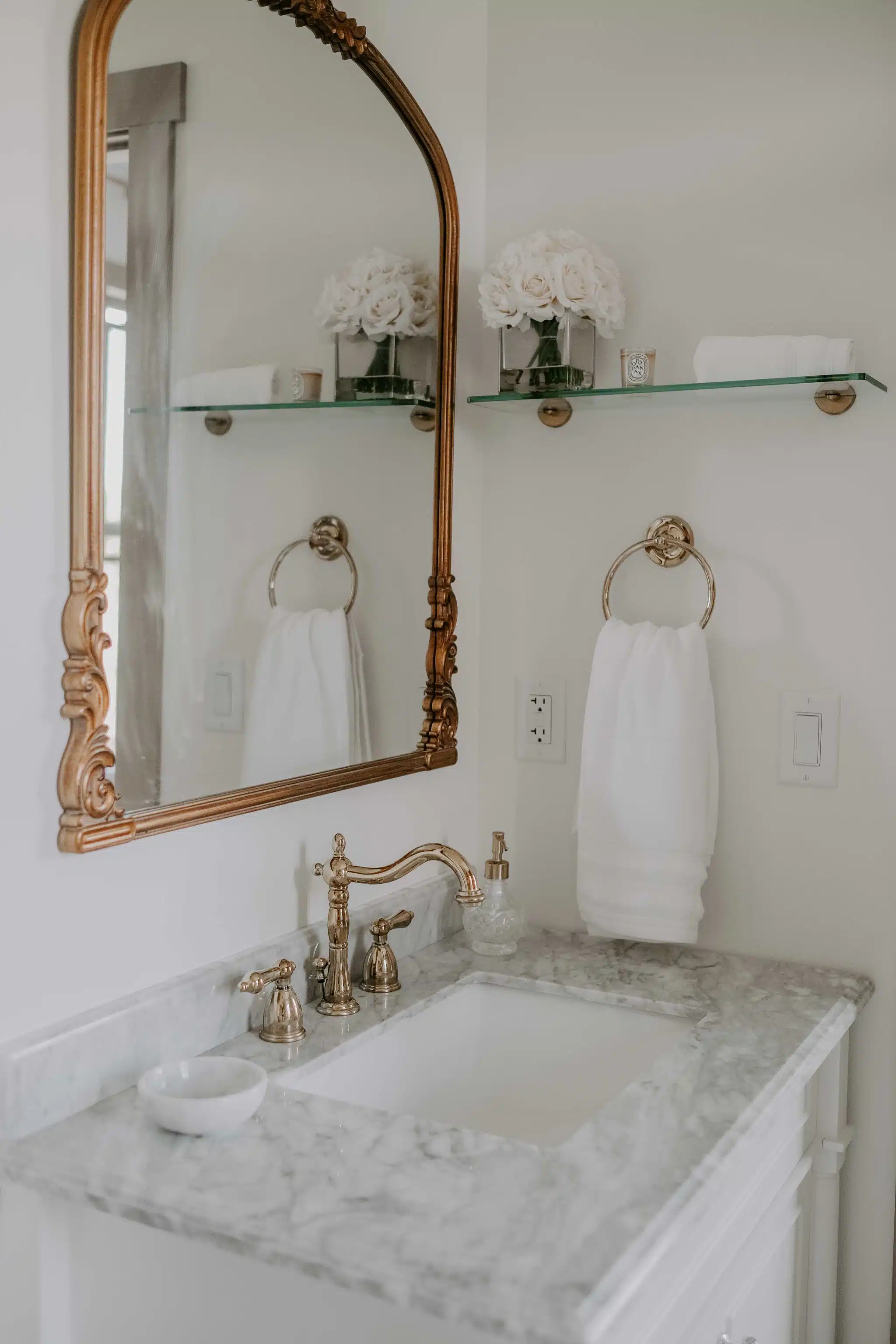 brass, marble, and white bathroom