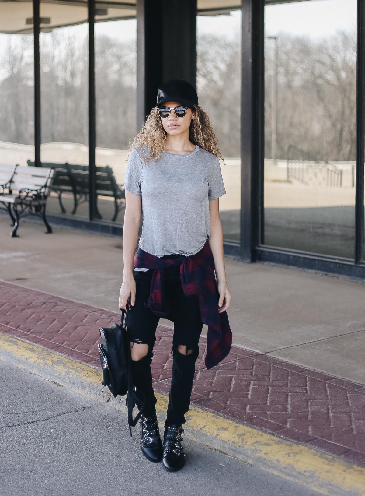 comfy airport outfit with a basic tee and ankle boots