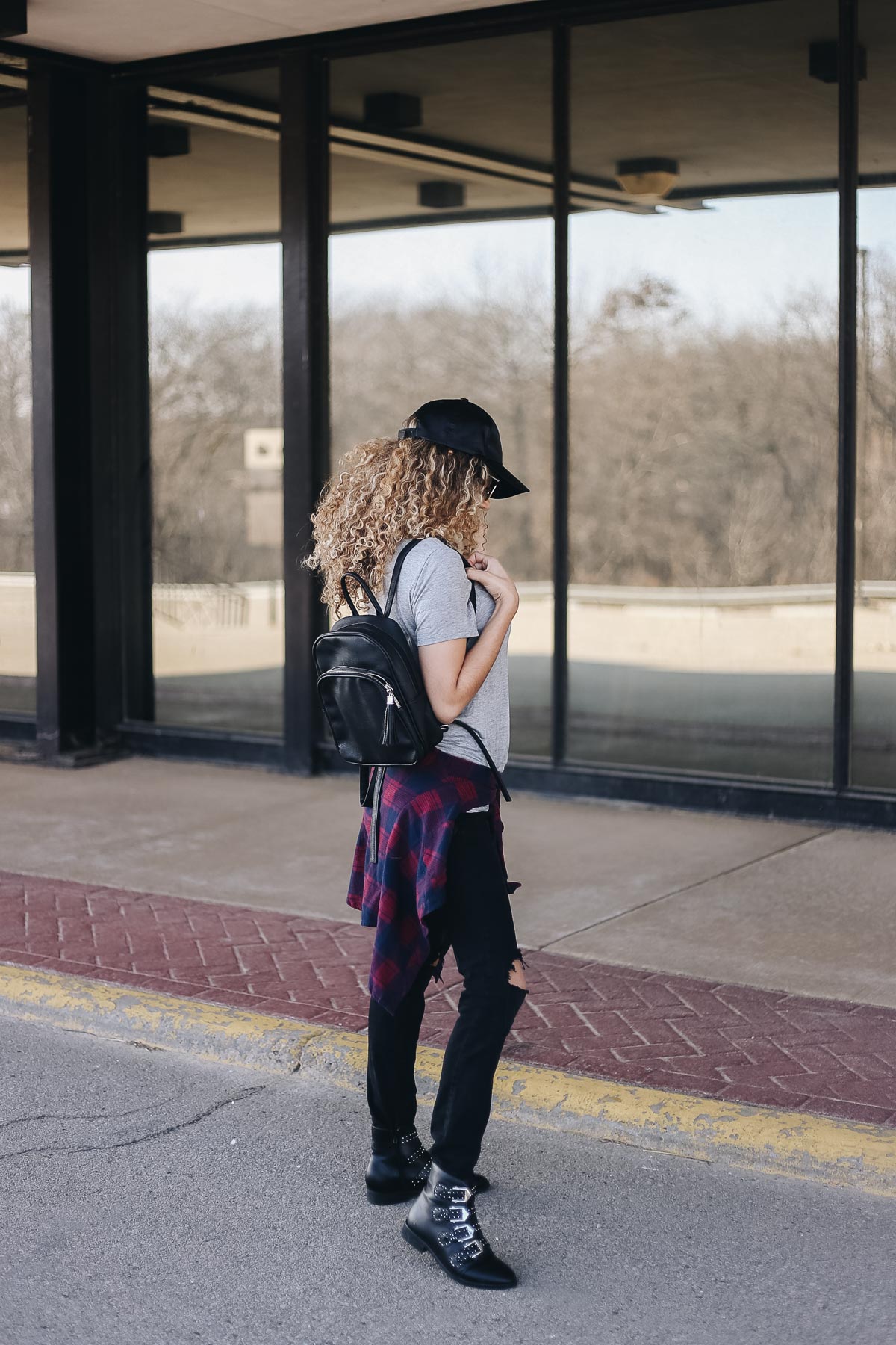 comfy airport outfit with a basic tee and ankle boots