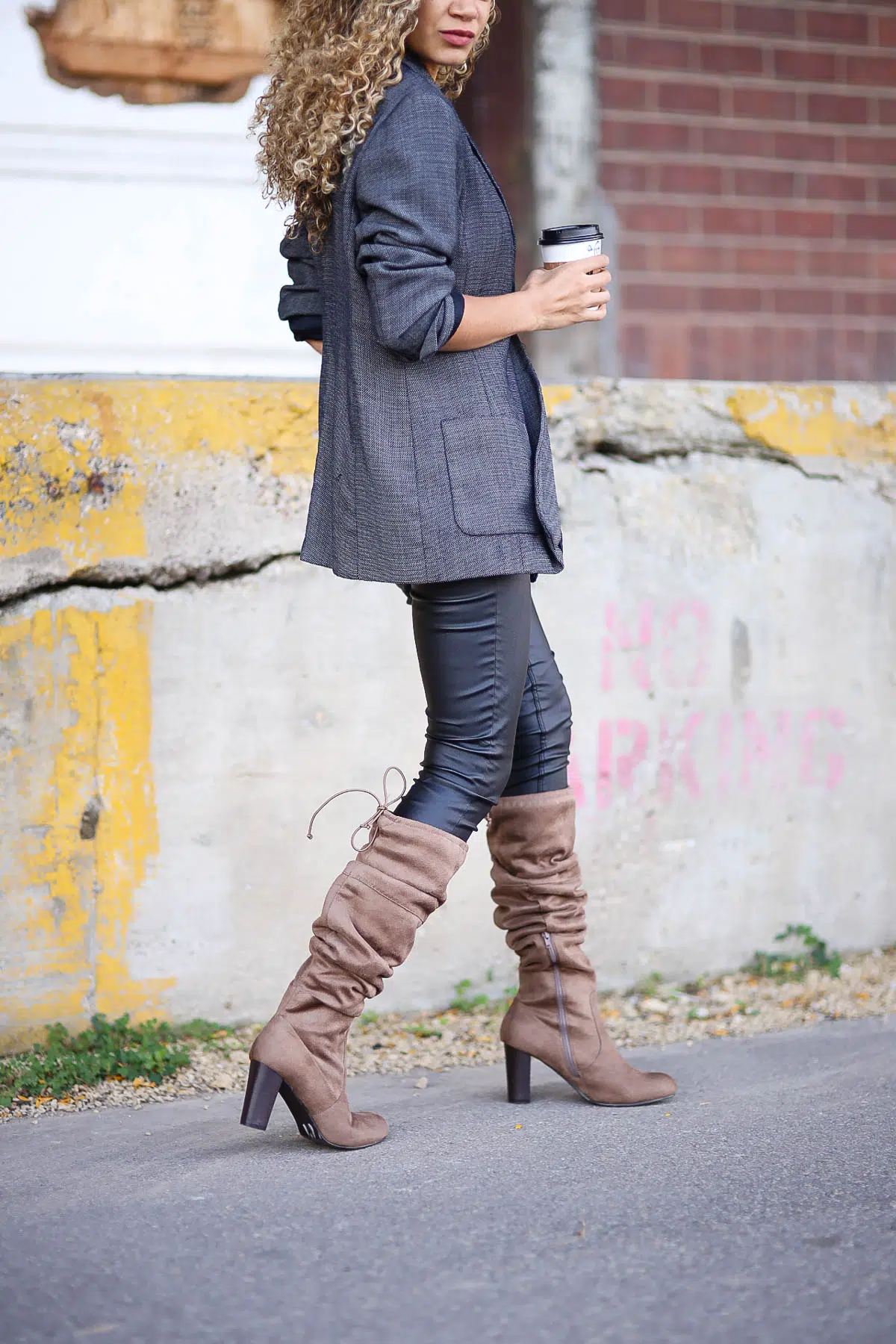 blazer, black leggings, and brown boot outfit