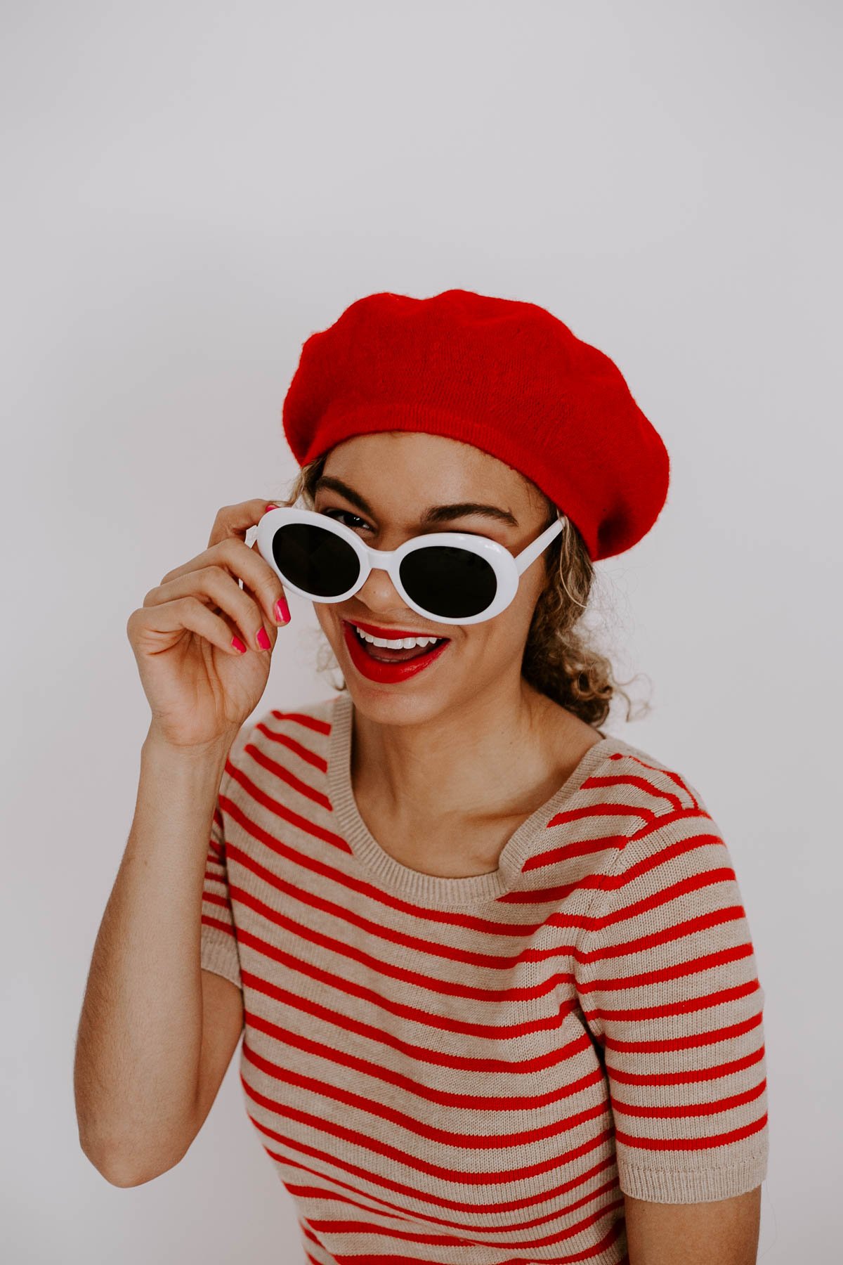 This red Parisian chic outfit with the striped top and beret is what all French style outfit dreams are made of!