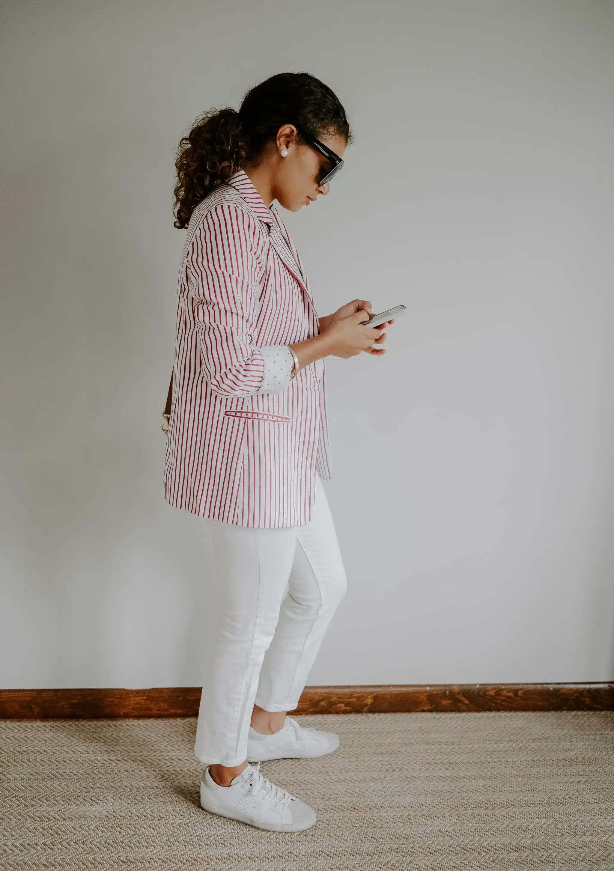 red striped blazer and white jeans outfit