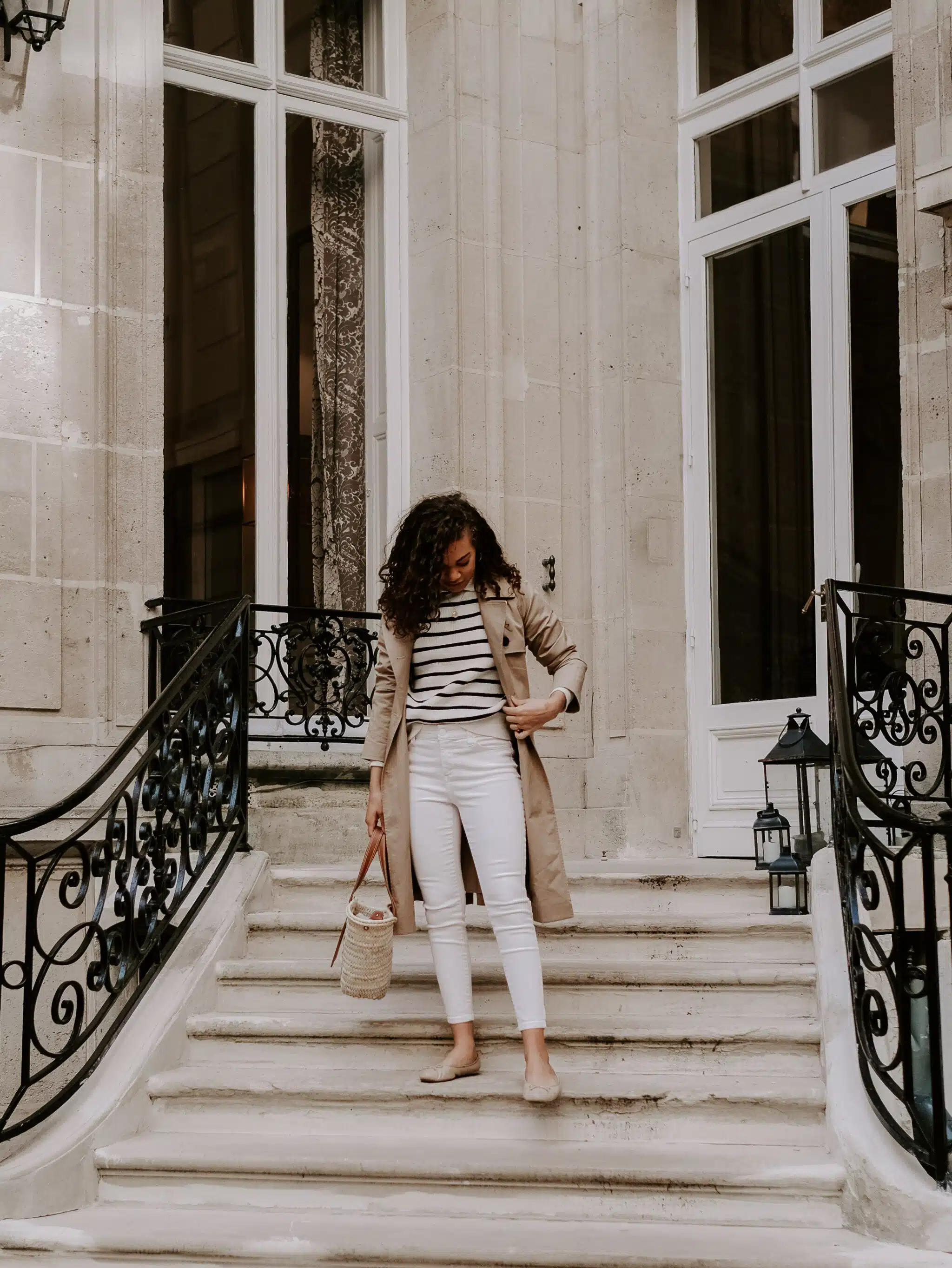 trench coat, striped sweater, white jeans outfit