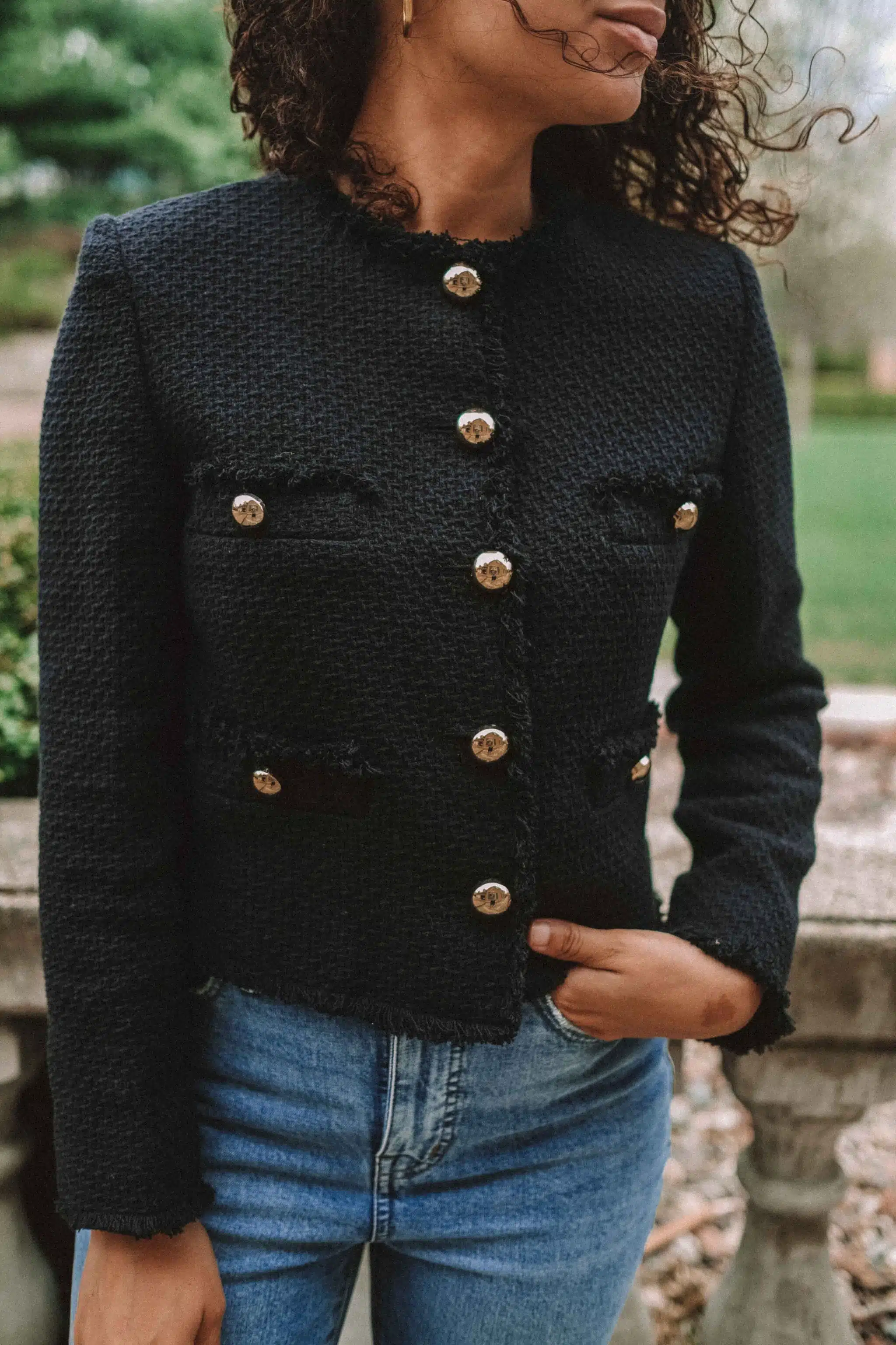 black tweed lady jacket and jeans