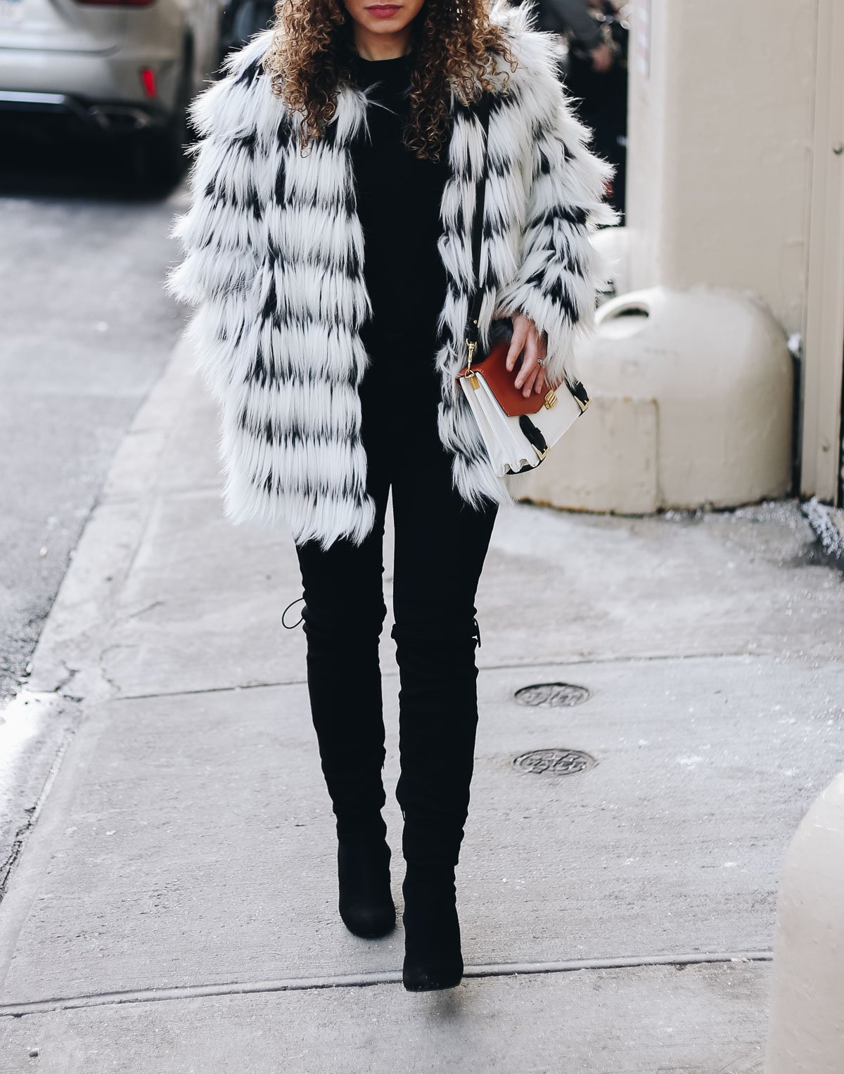 Faux fur statement coat to complete your winter travel outfit!