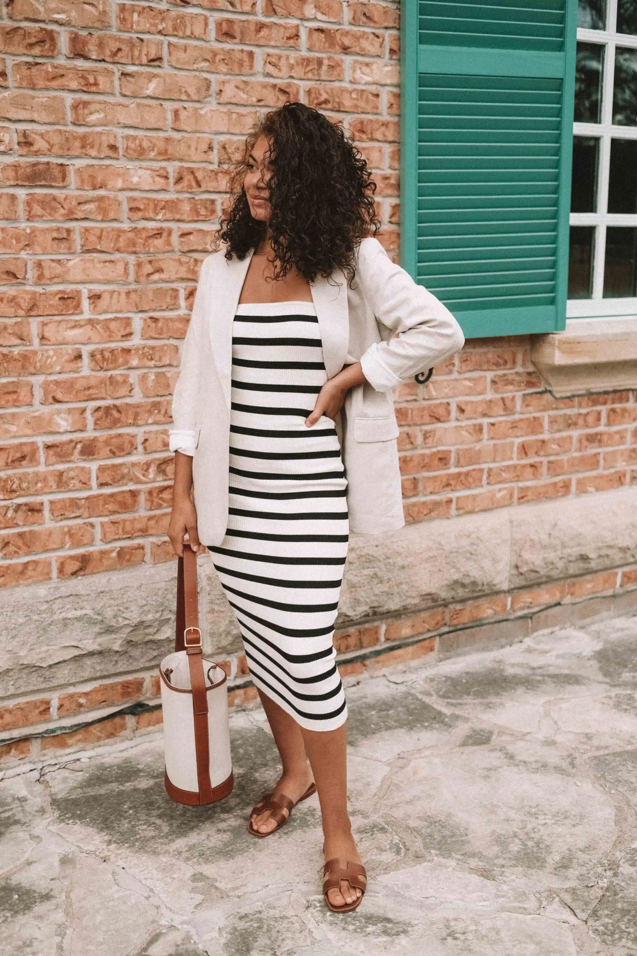 striped bodycon strapless dress, linen blazer, and hermes oran sandals