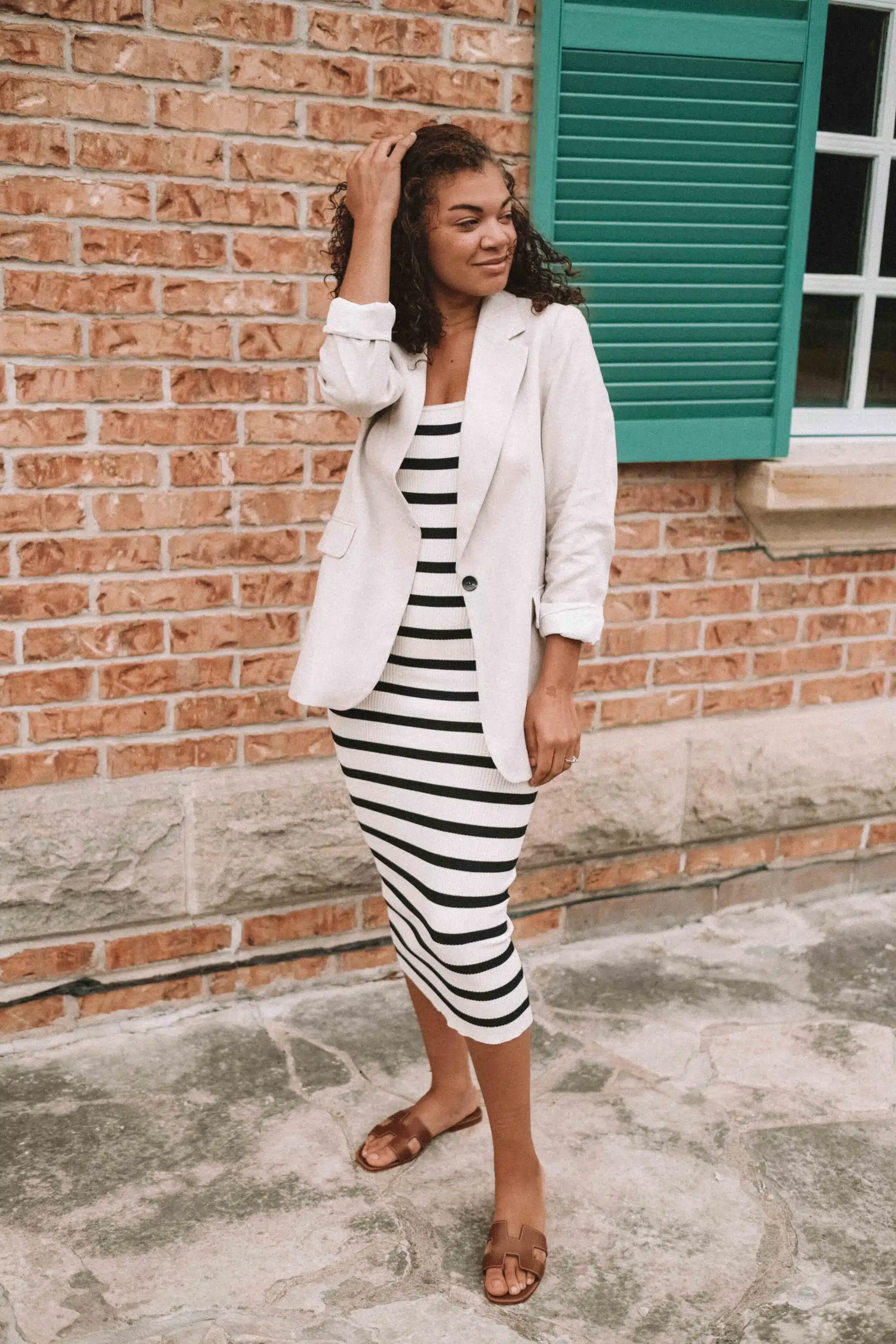 striped bodycon strapless dress, linen blazer, and hermes oran sandals